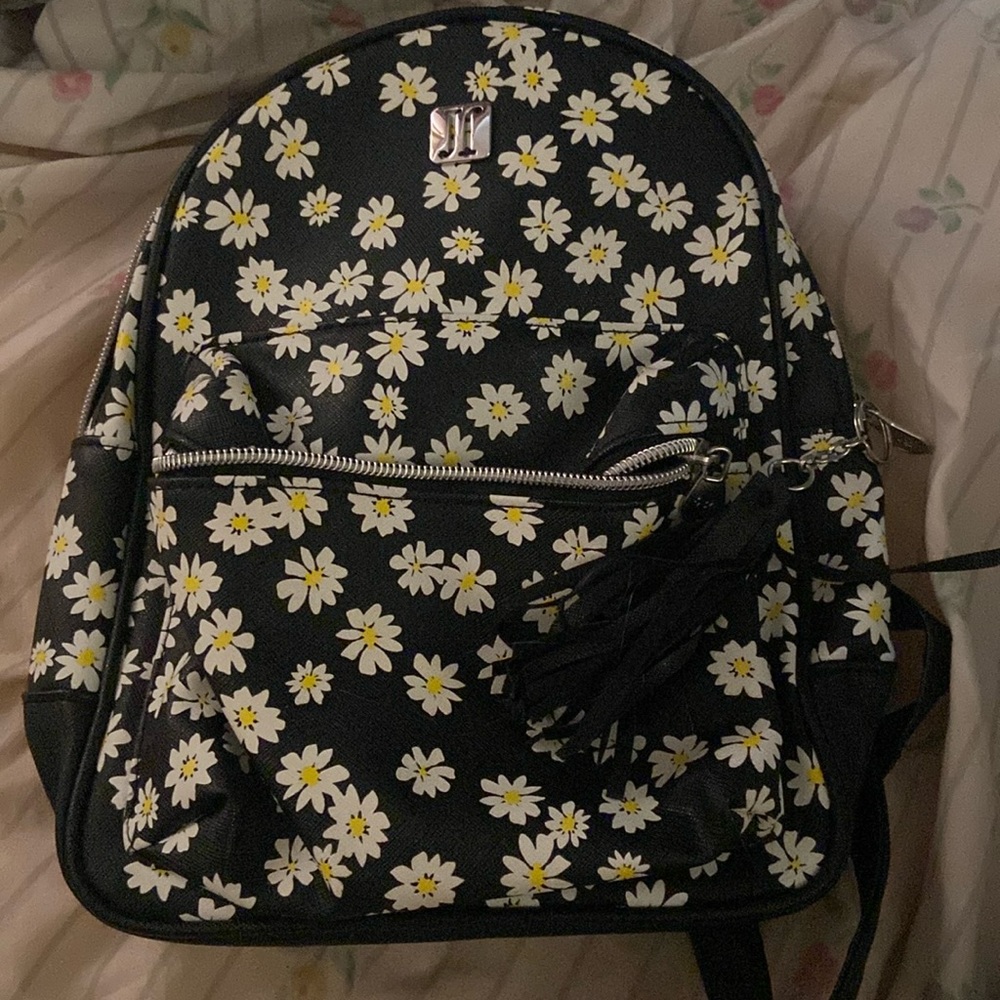 Mini backpack black with daisies on it
